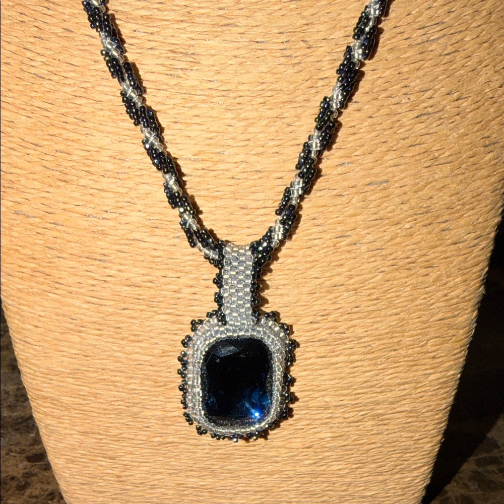 hand beaded faceted deep blue Blue  and Silver Pendant Necklace encased in beads